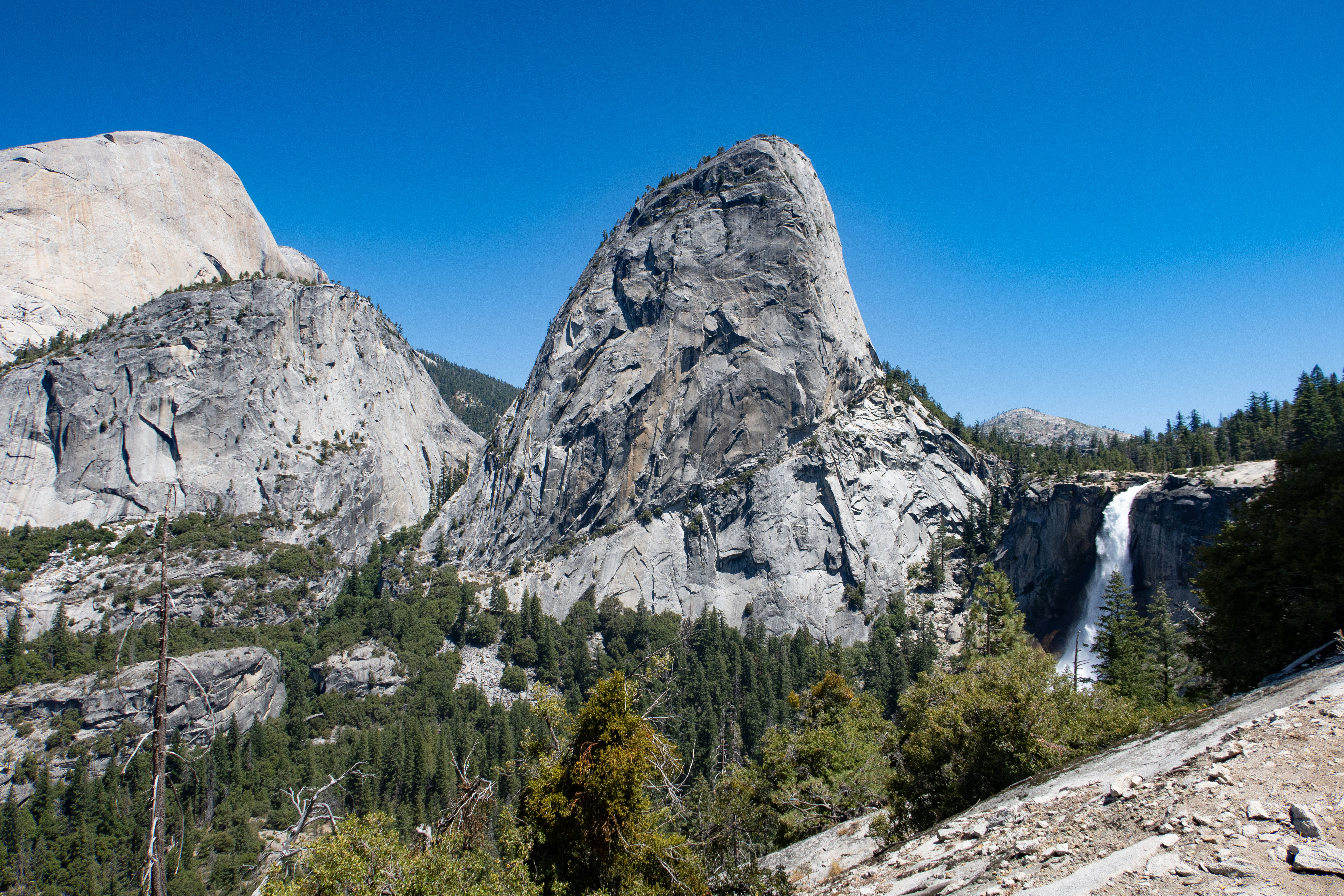 Liberty Cap and Nevada Fall viewed from above Vernal Fall on the Mist Trail in Yosemite National Park. Liberty Cap and Nevada Fall viewed from above Vernal Fall on the Mist Trail in Yosemite National Park.