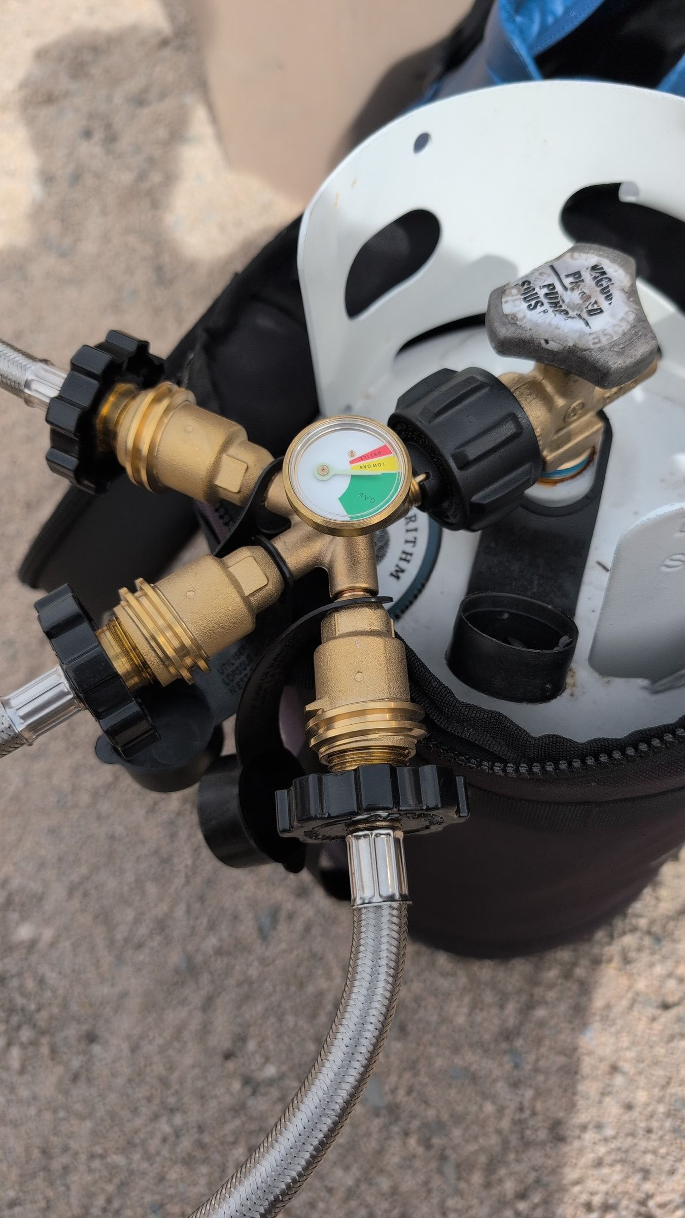 Photo of triple adapter with pressure gauge mounted on the propane tank