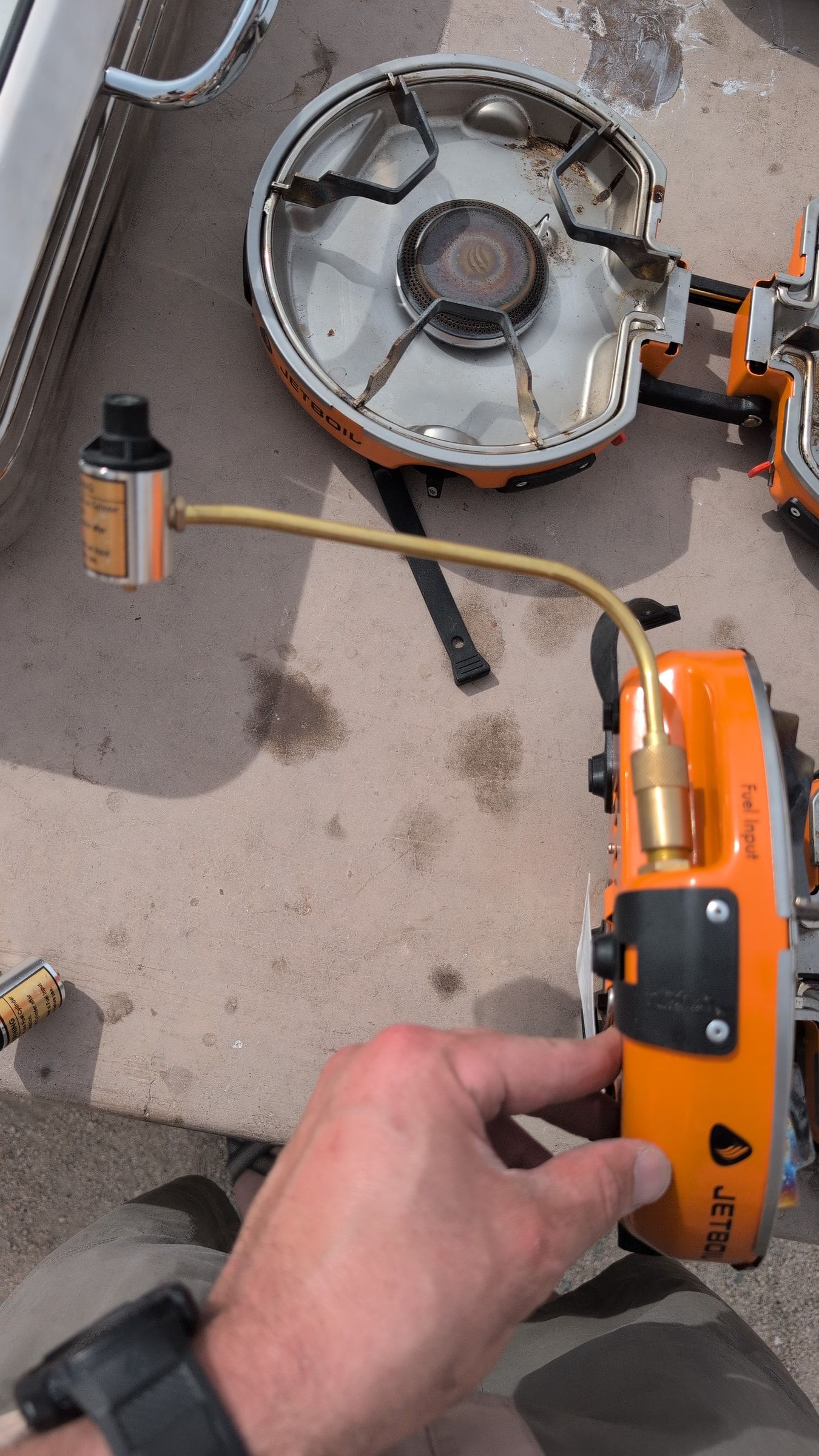 Close-up of brass fuel fitting installed on the Jetboil burner fuel inlet
