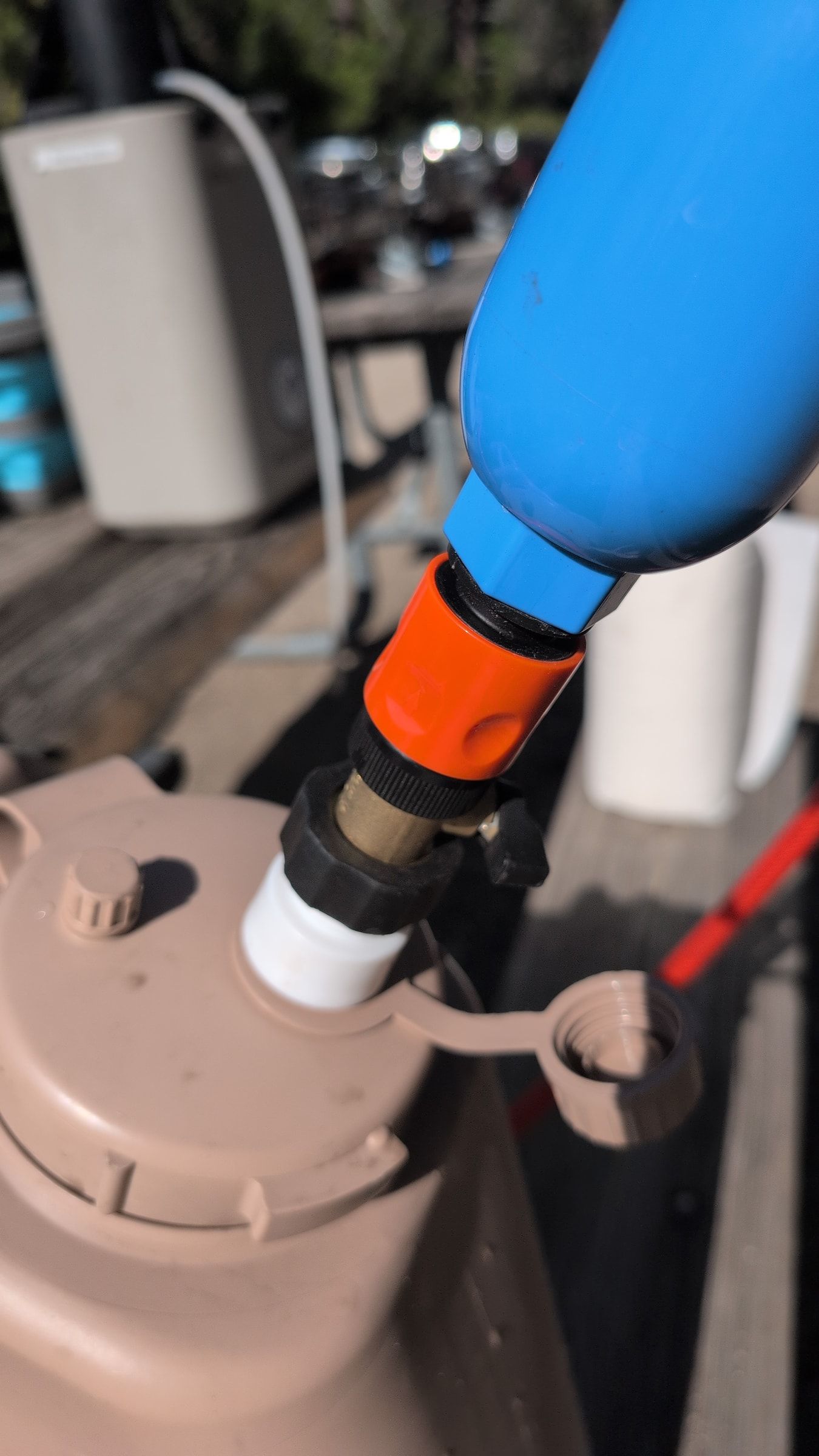 Photo of inline filter connected to Scepter water jug outlet