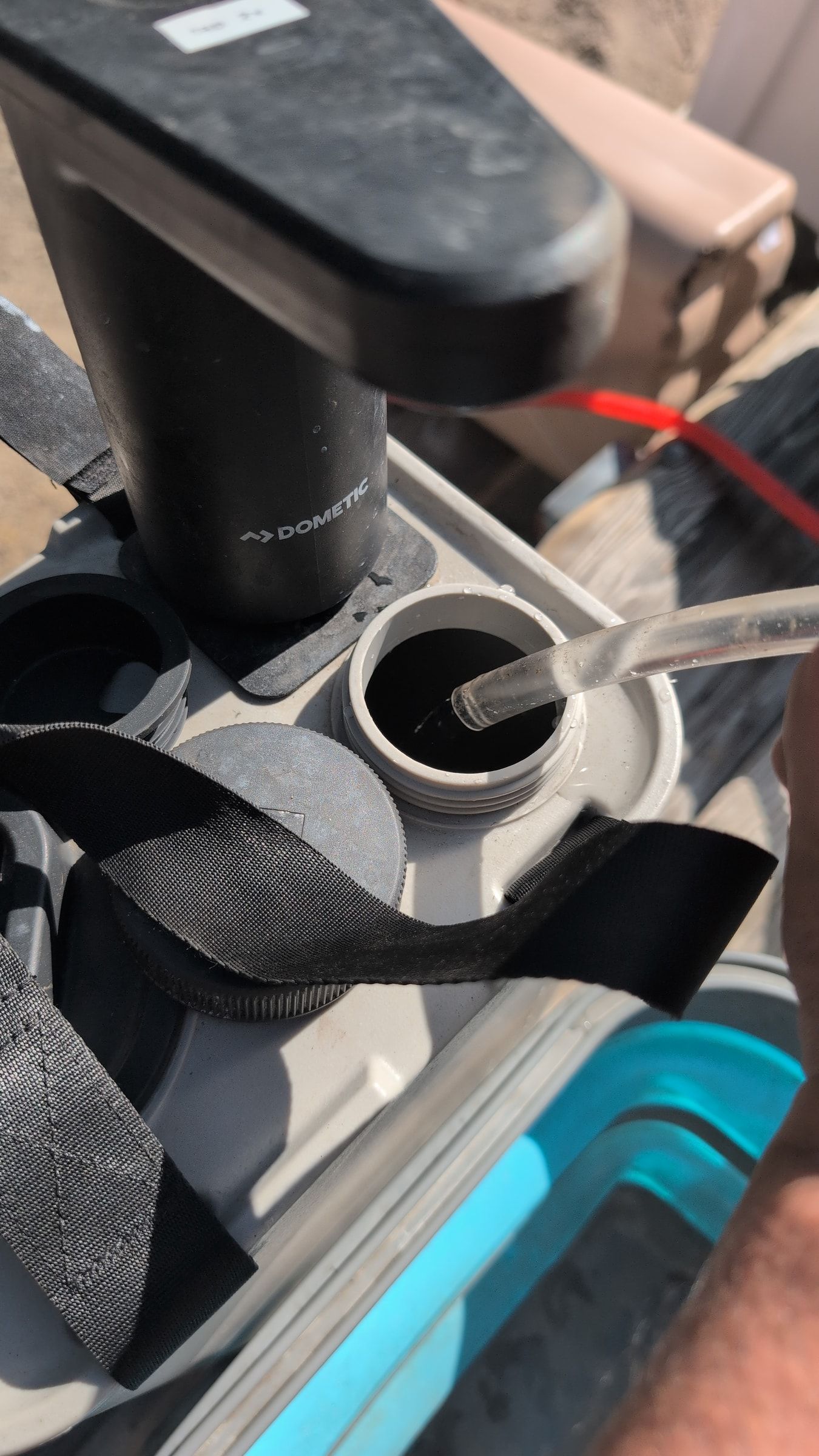 Photo of outlet hose draining initial water into separate catch container