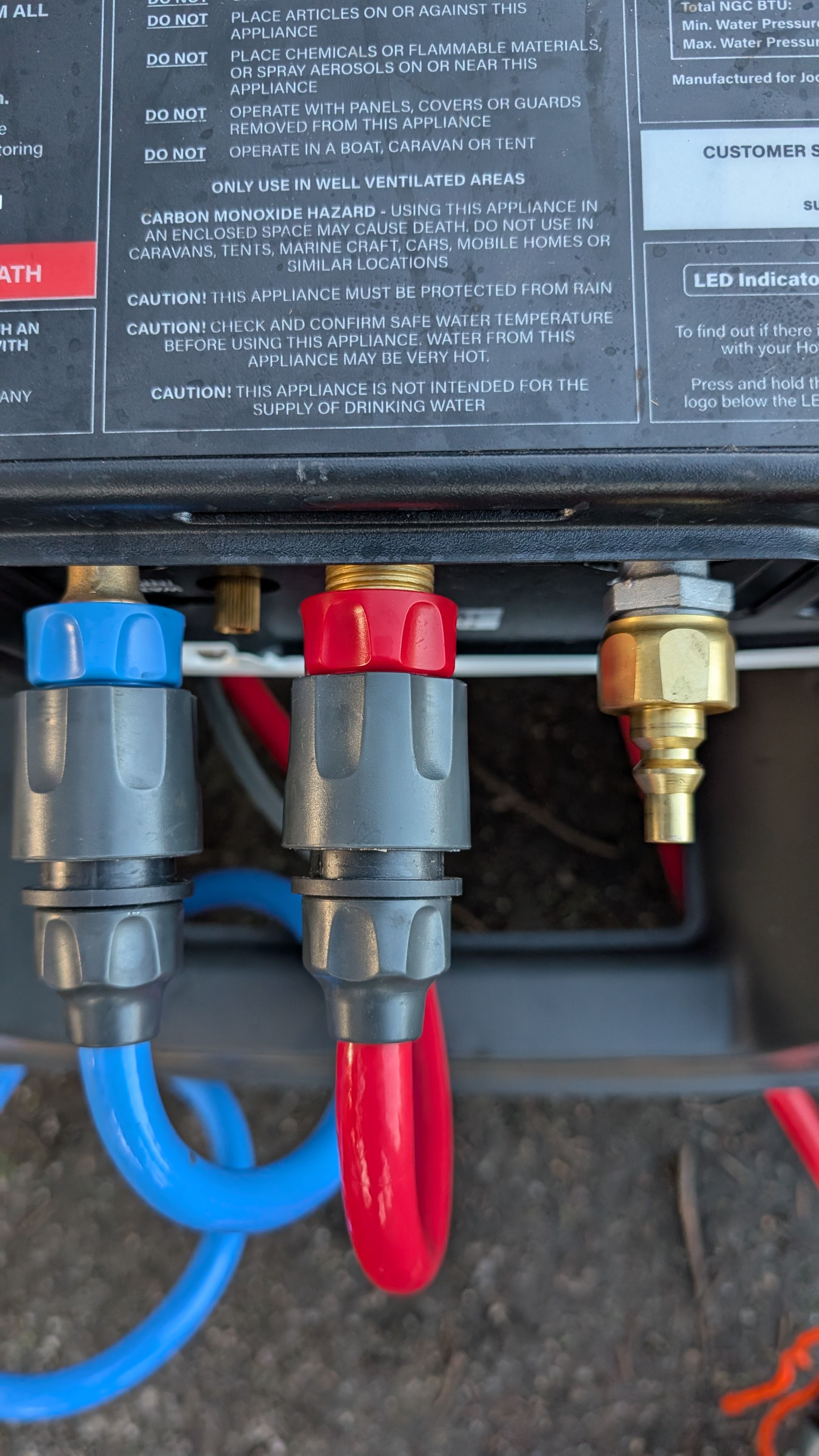 Close-up of all three connections on bottom of Hottap heater