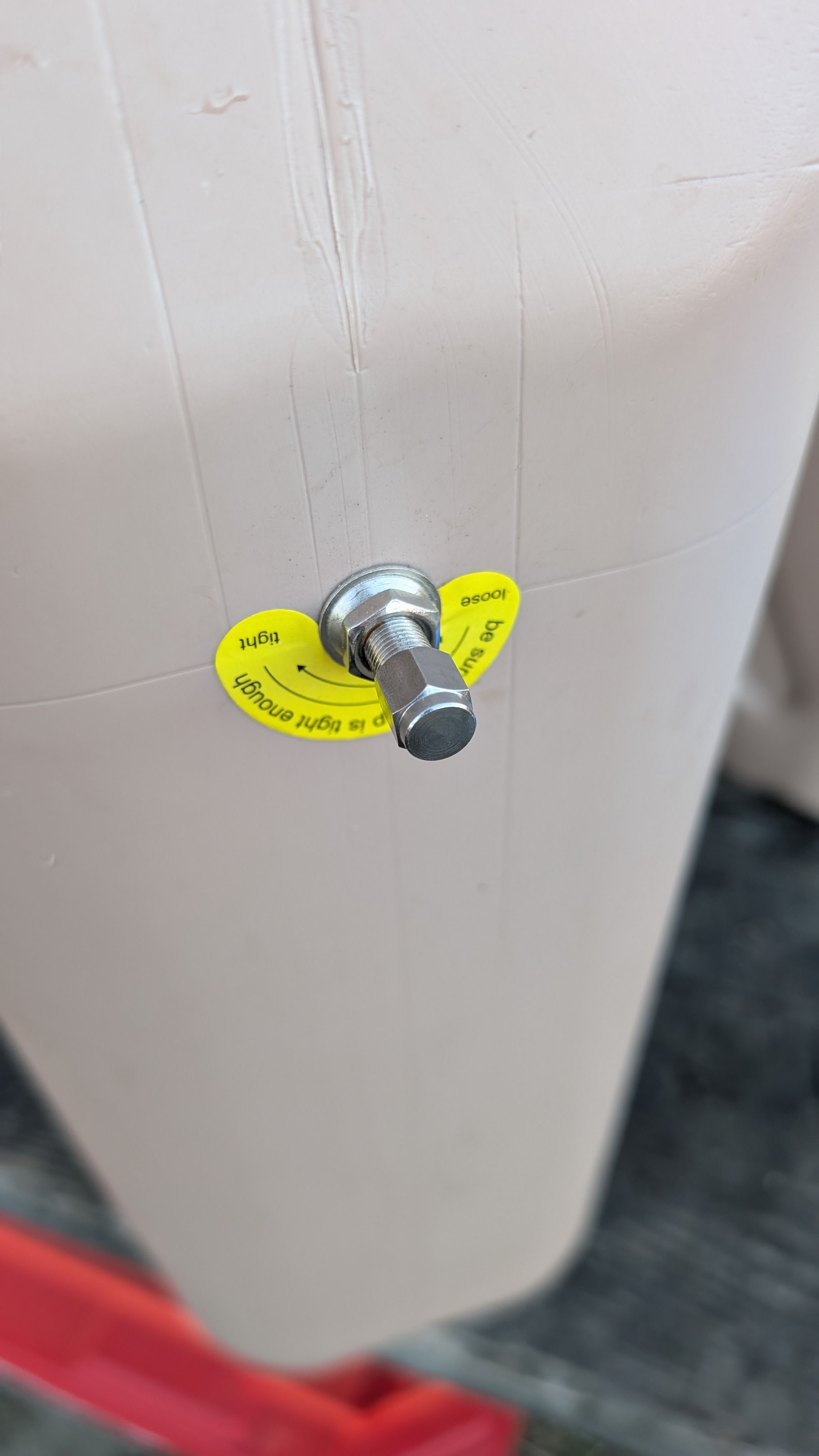 Photo of bleed valve on top of Scepter jug with yellow sticker