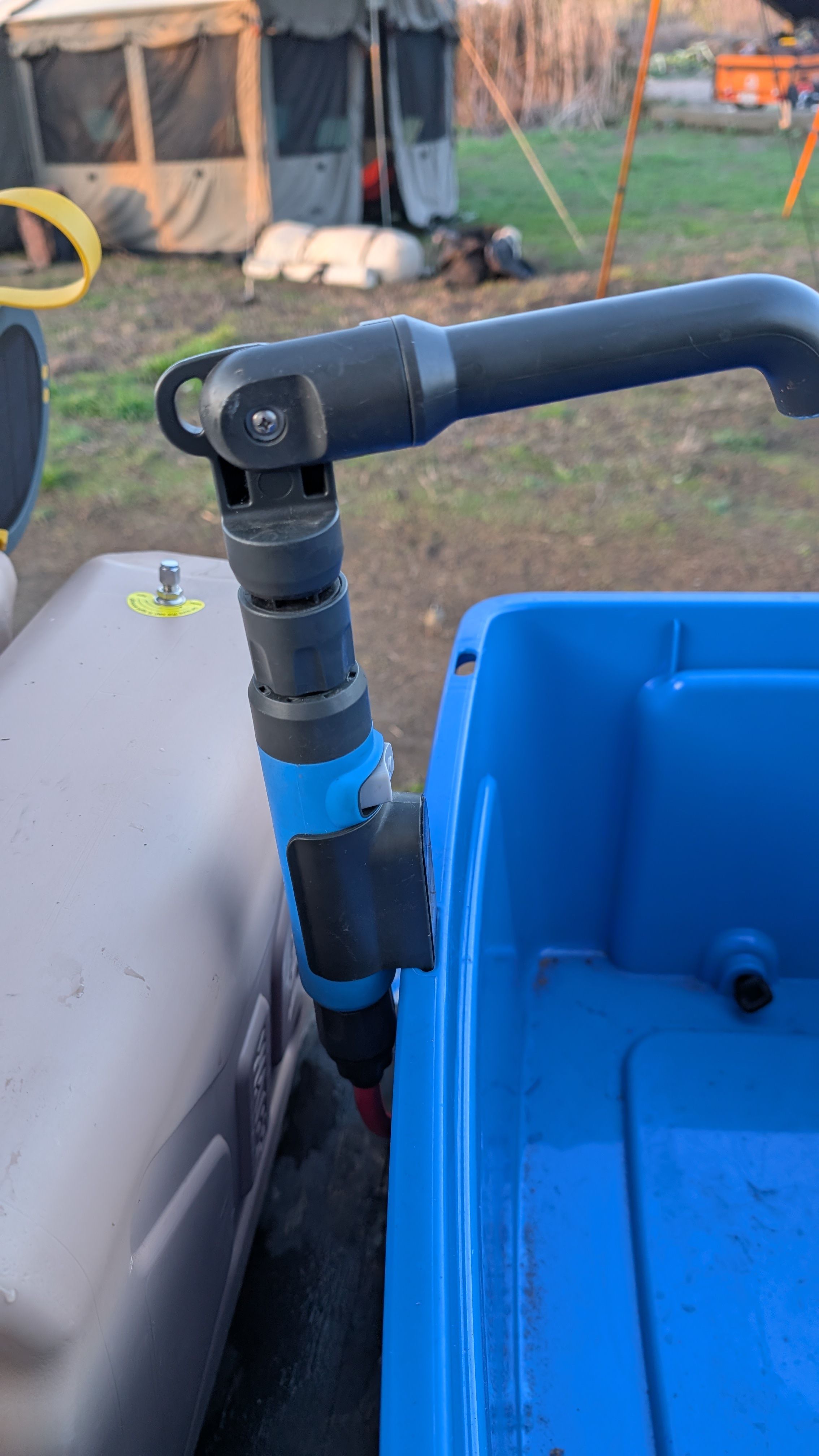 Photo of faucet installed in center divider of blue Joolca tub