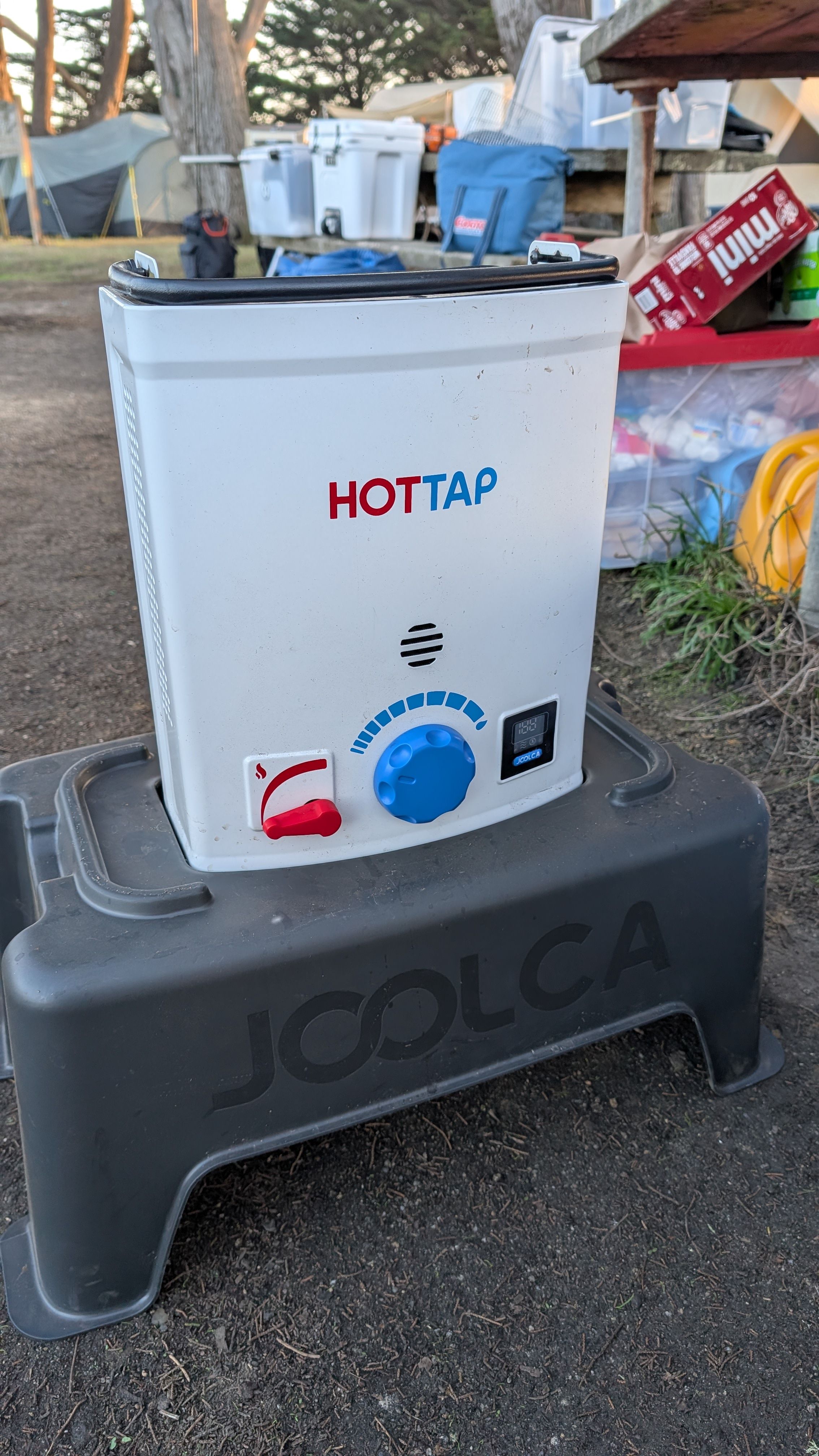Photo of Joolca Hottap water heater on gray carrying stand