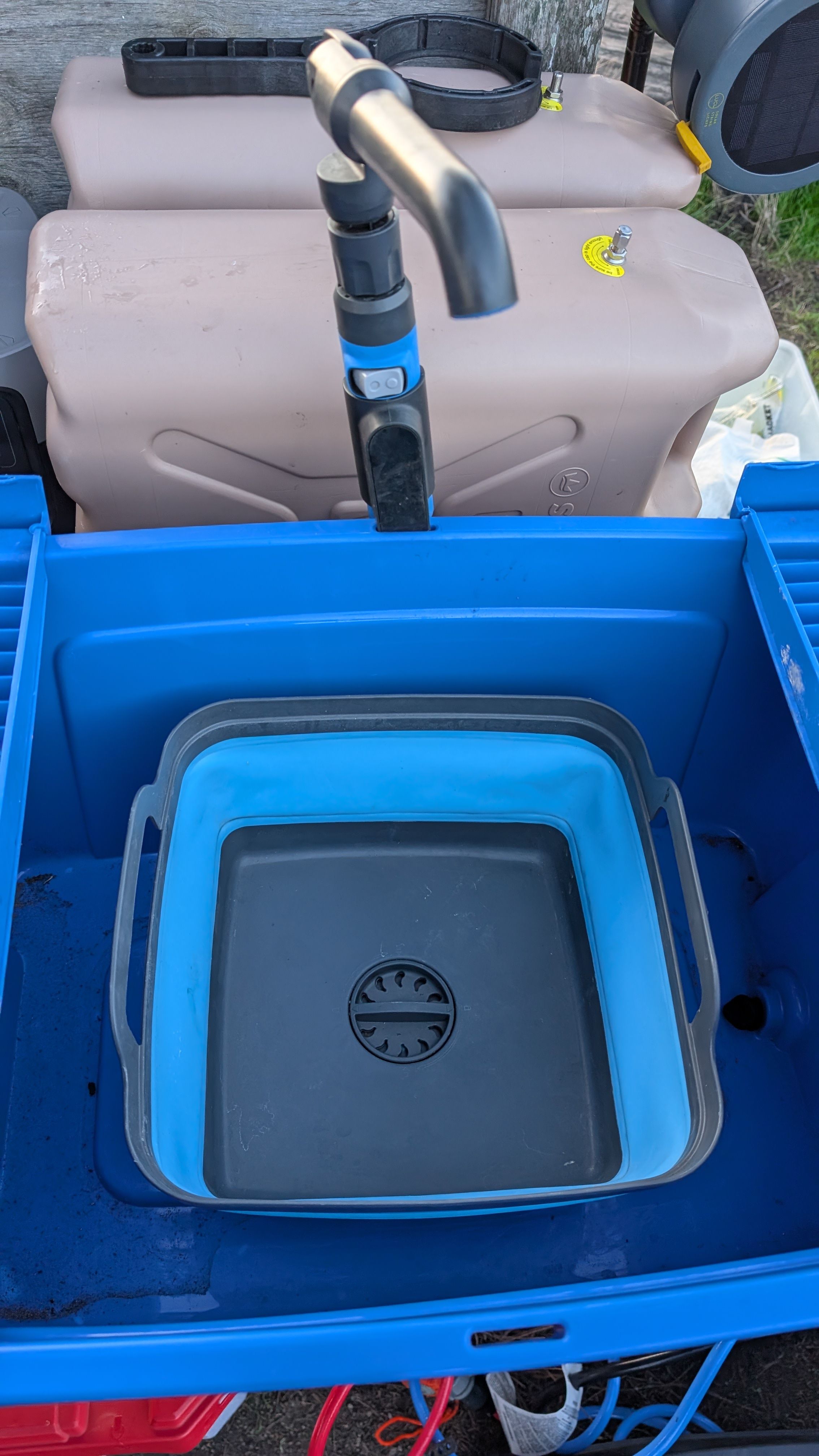 Photo of small wash basin placed inside the Joolca tub with faucet above