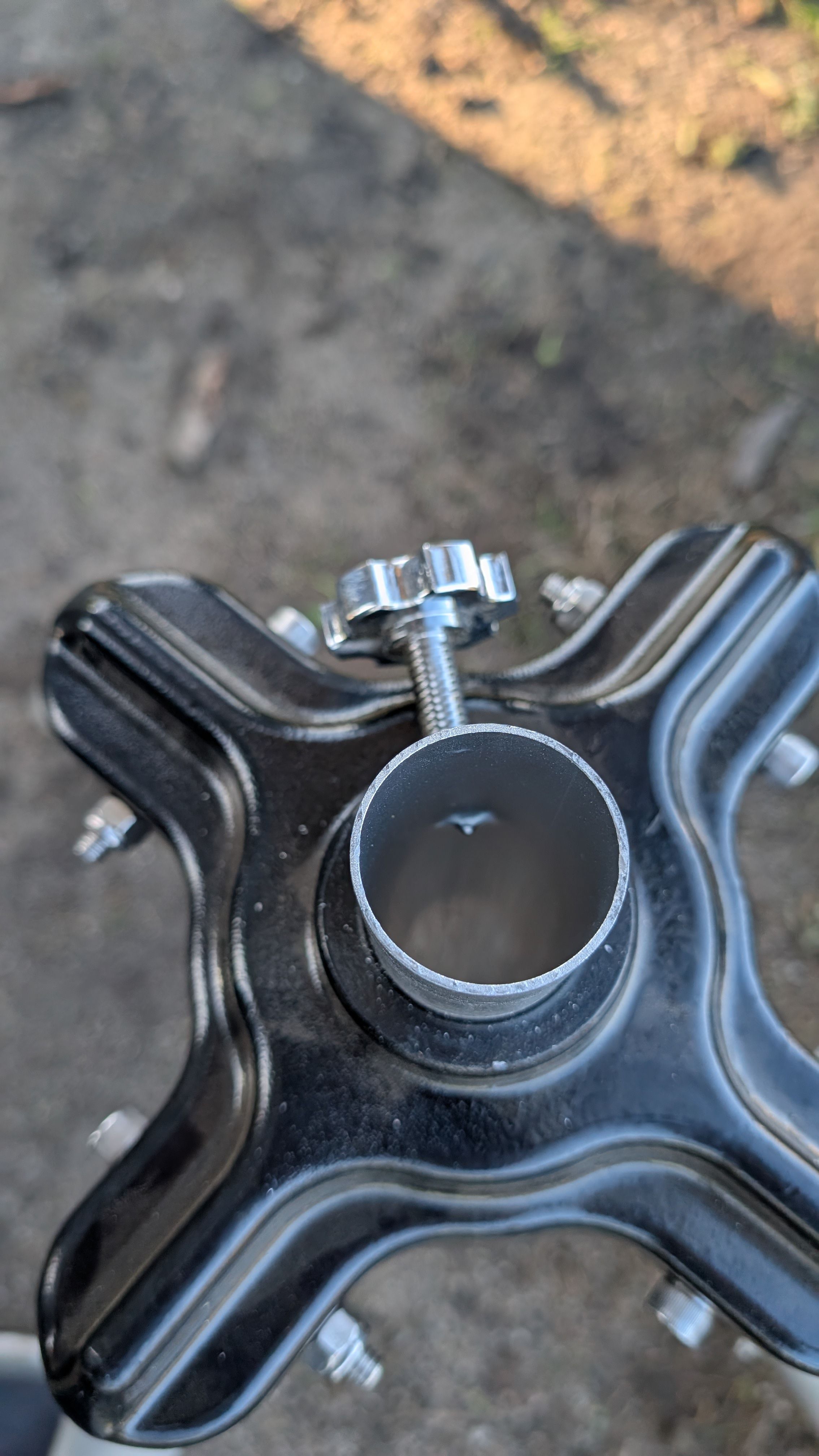 Close-up of tripod center tube locking pin screwed into position
