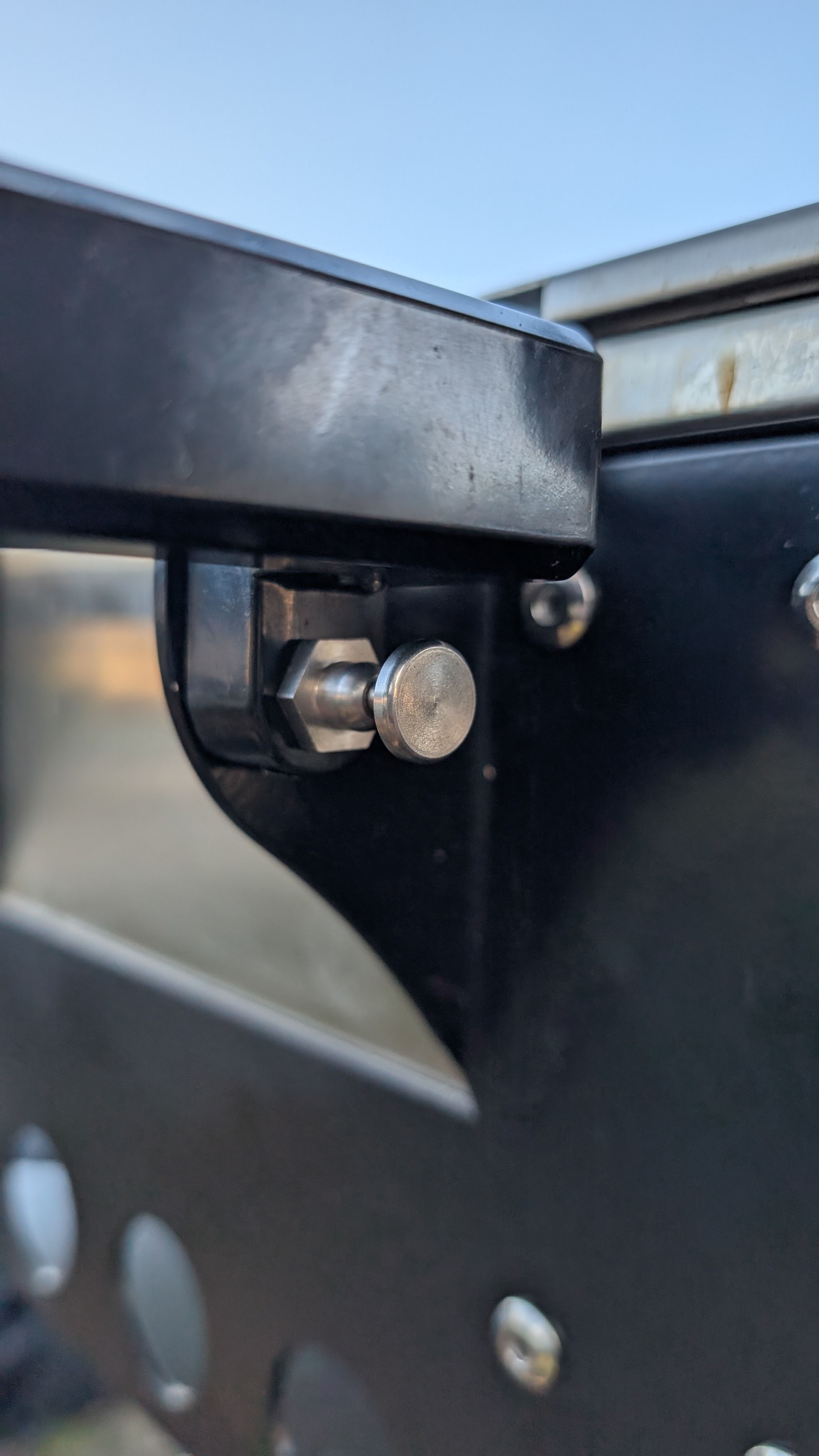 Photo of side handle pin that needs to be pulled out to deploy cutting board handles