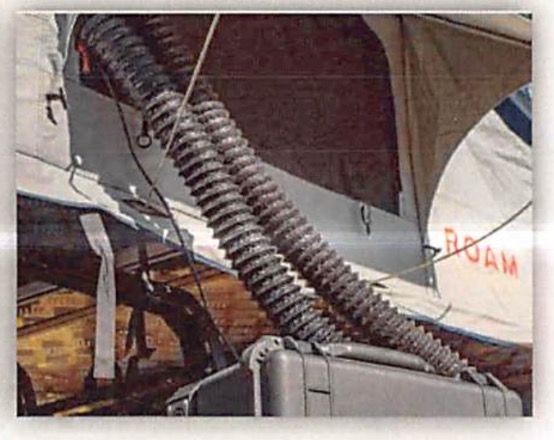 Photo of heater ducts routed through tent door opening