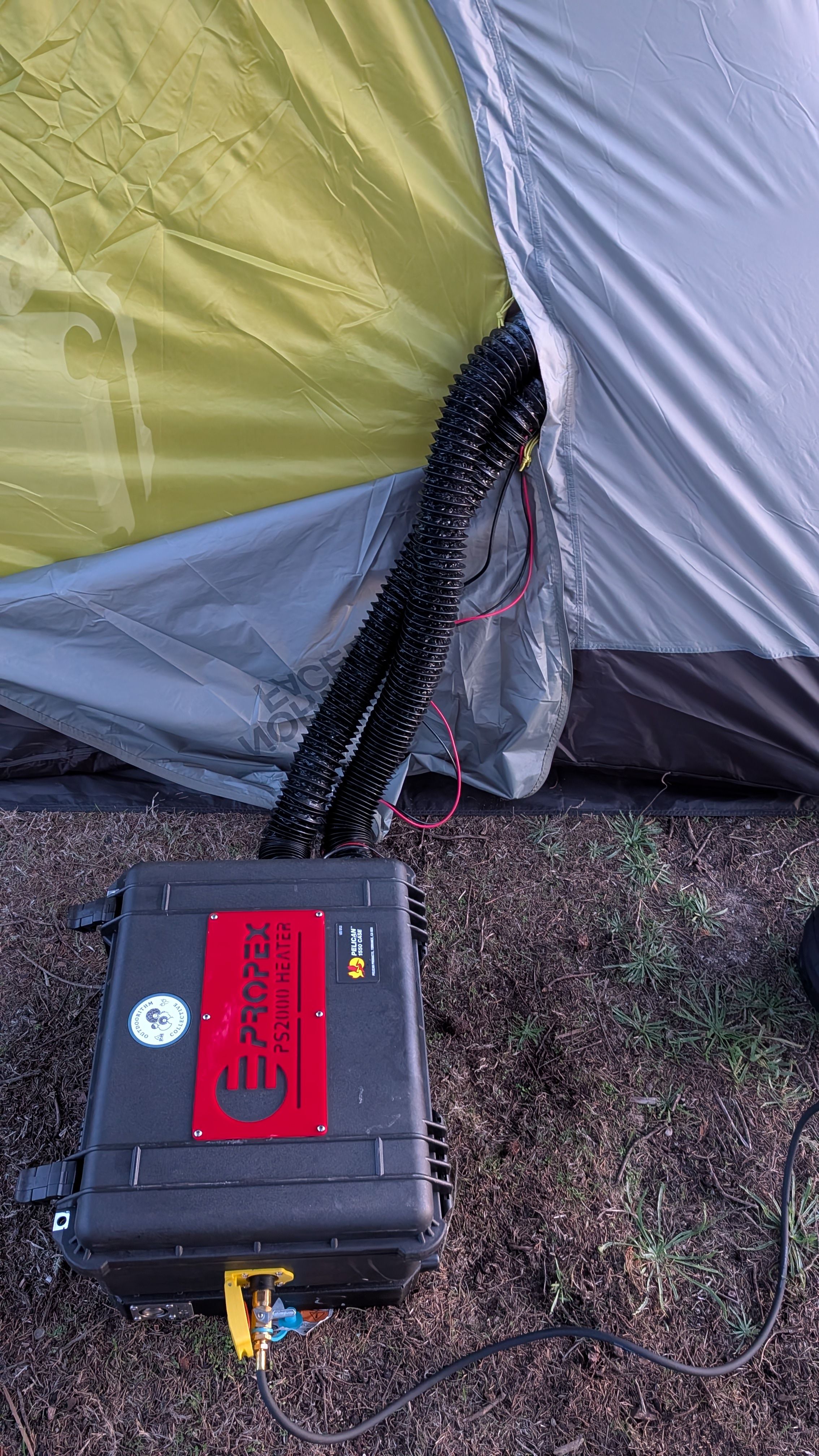 Photo of Propex HS2000 heater positioned outside tent near door opening