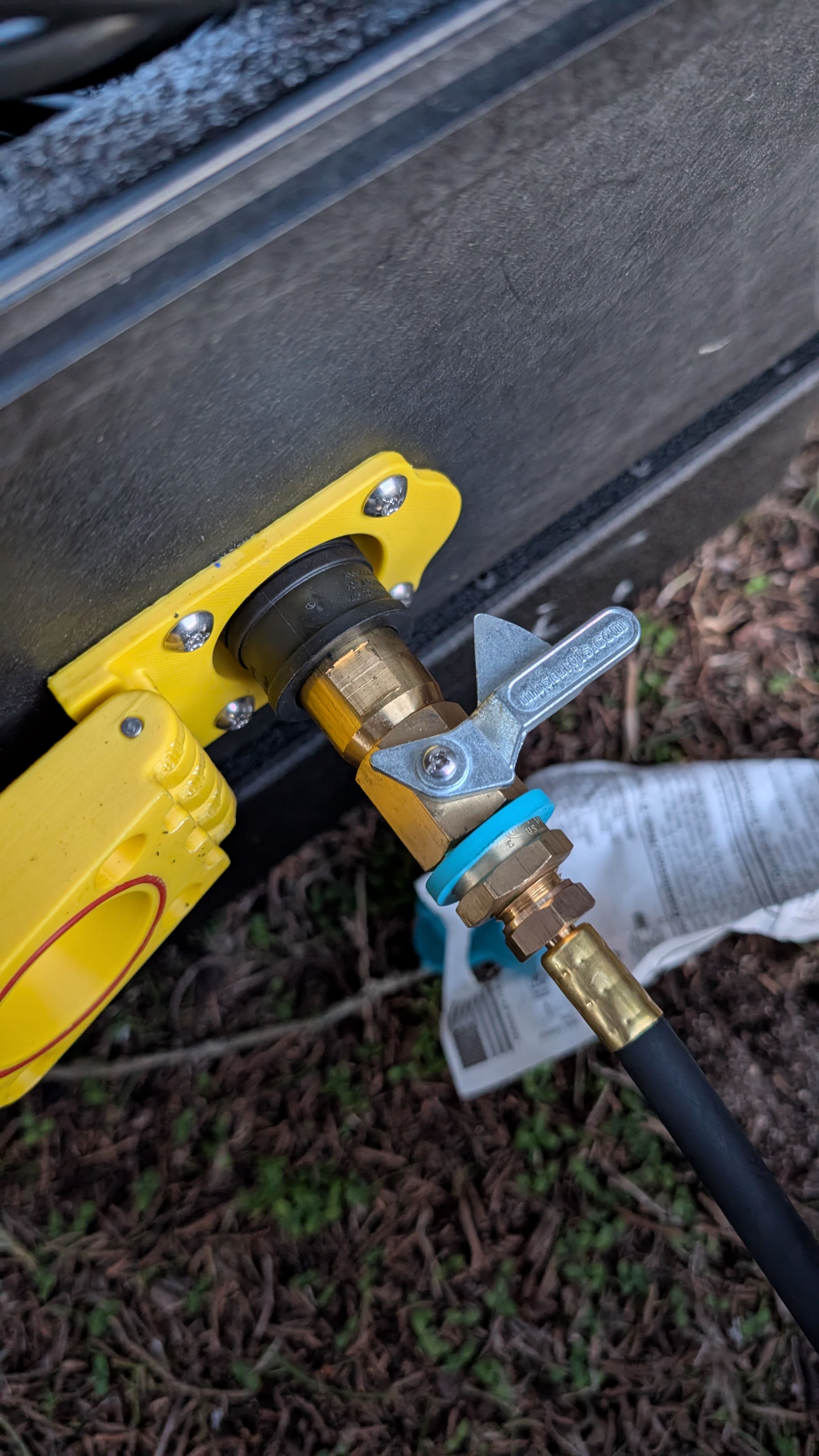 Side-by-side photo showing propane valve in closed position and open position