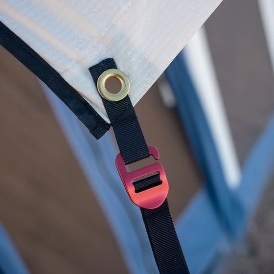 Close-up of Stormfly speed buckle strap attached to tent frame