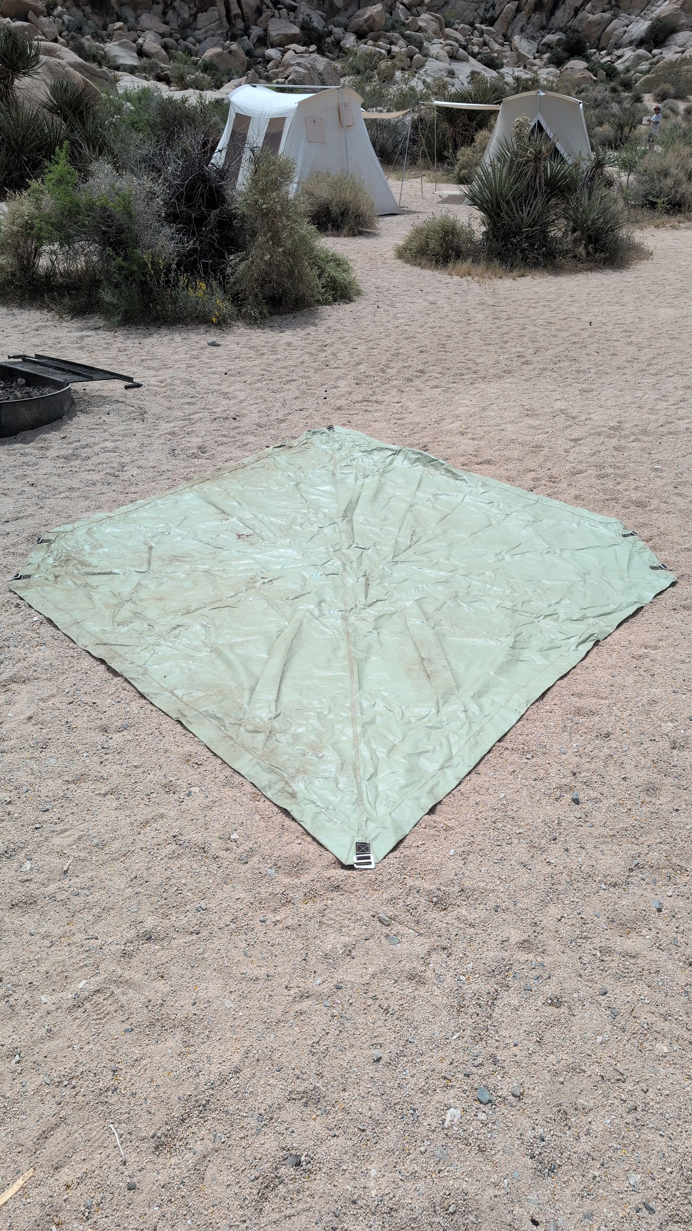 Photo of ground sheet laid flat on site