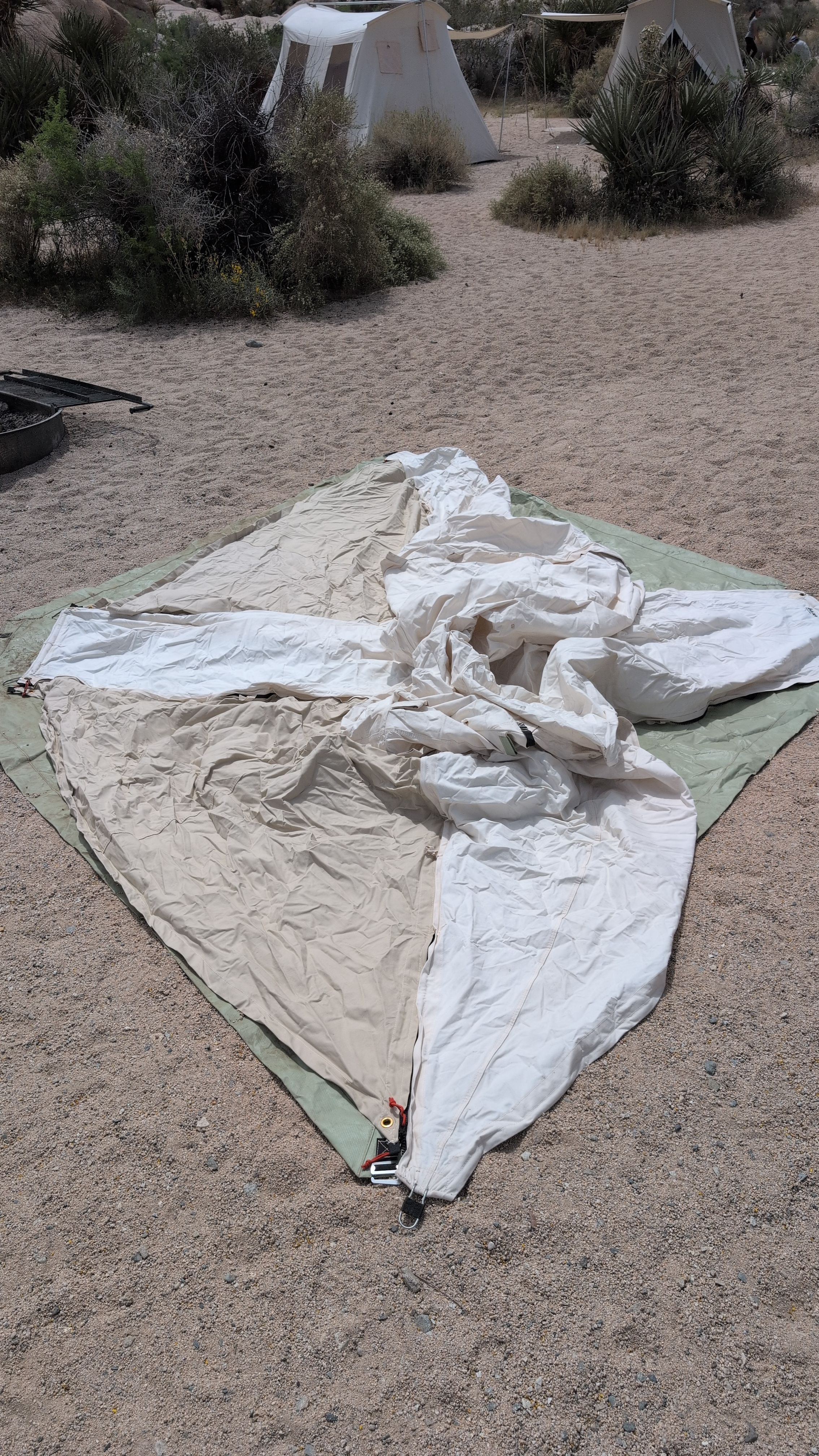 Photo of shelter body spread on ground sheet, oriented