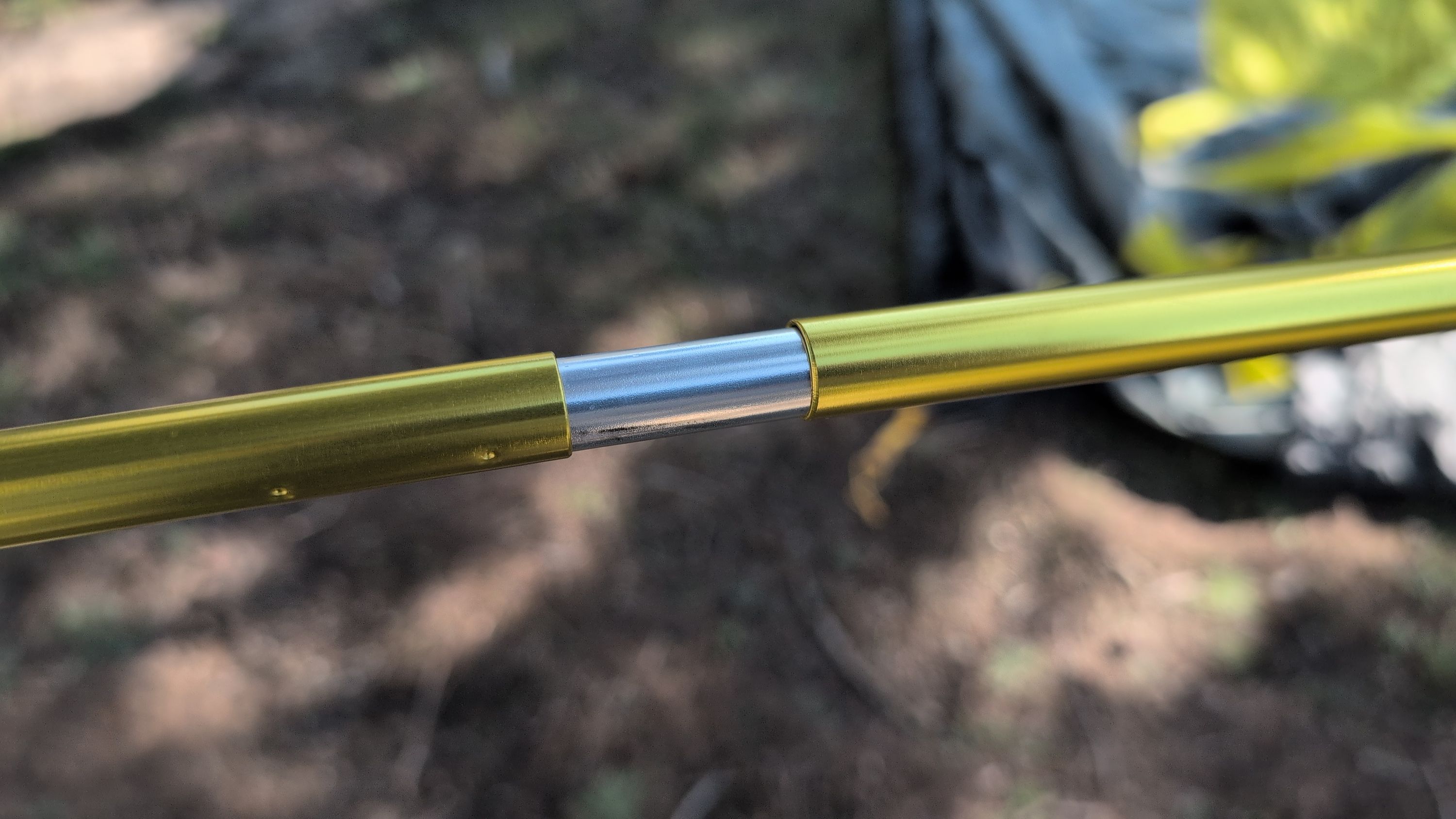 Close-up of pole sections being connected
