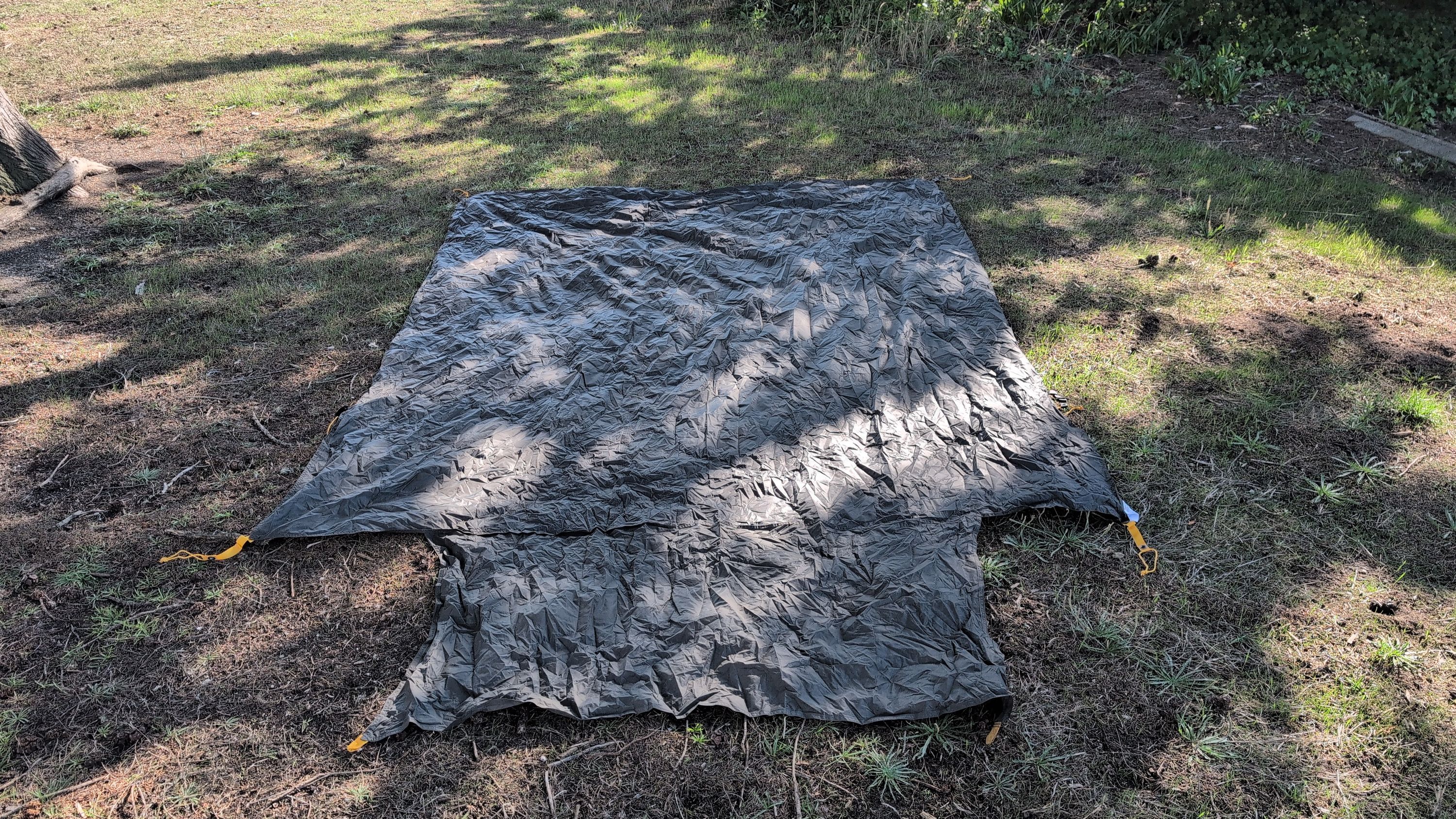 Photo of ground sheet laid flat with doormat flap visible