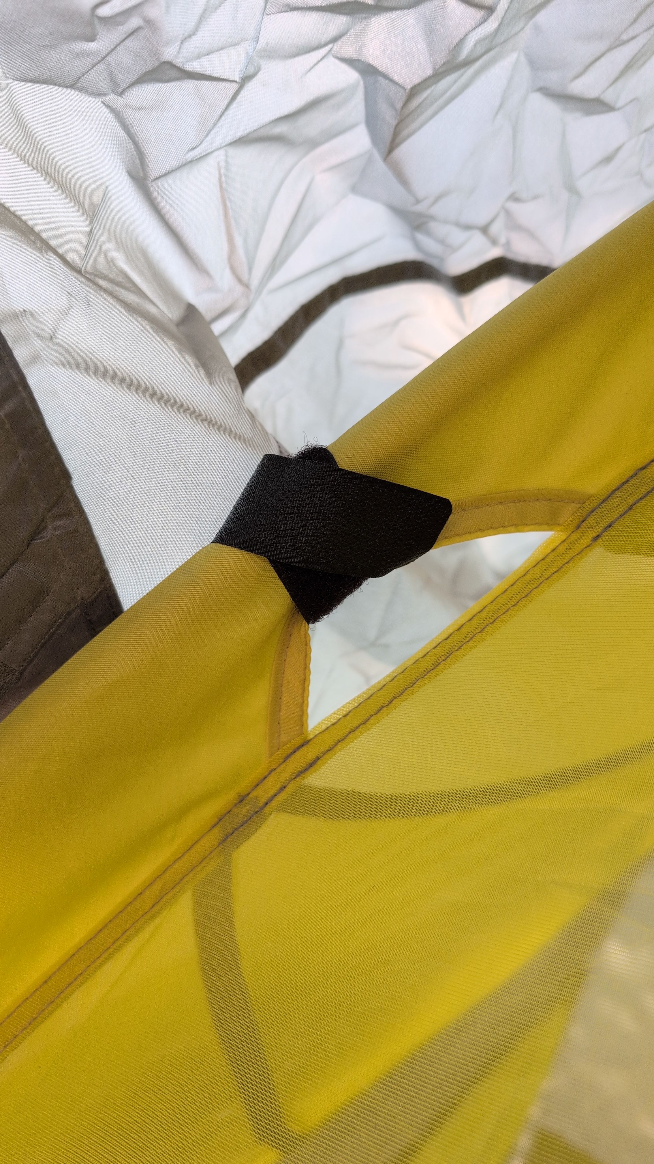 Photo of velcro strap wrapped around tent pole