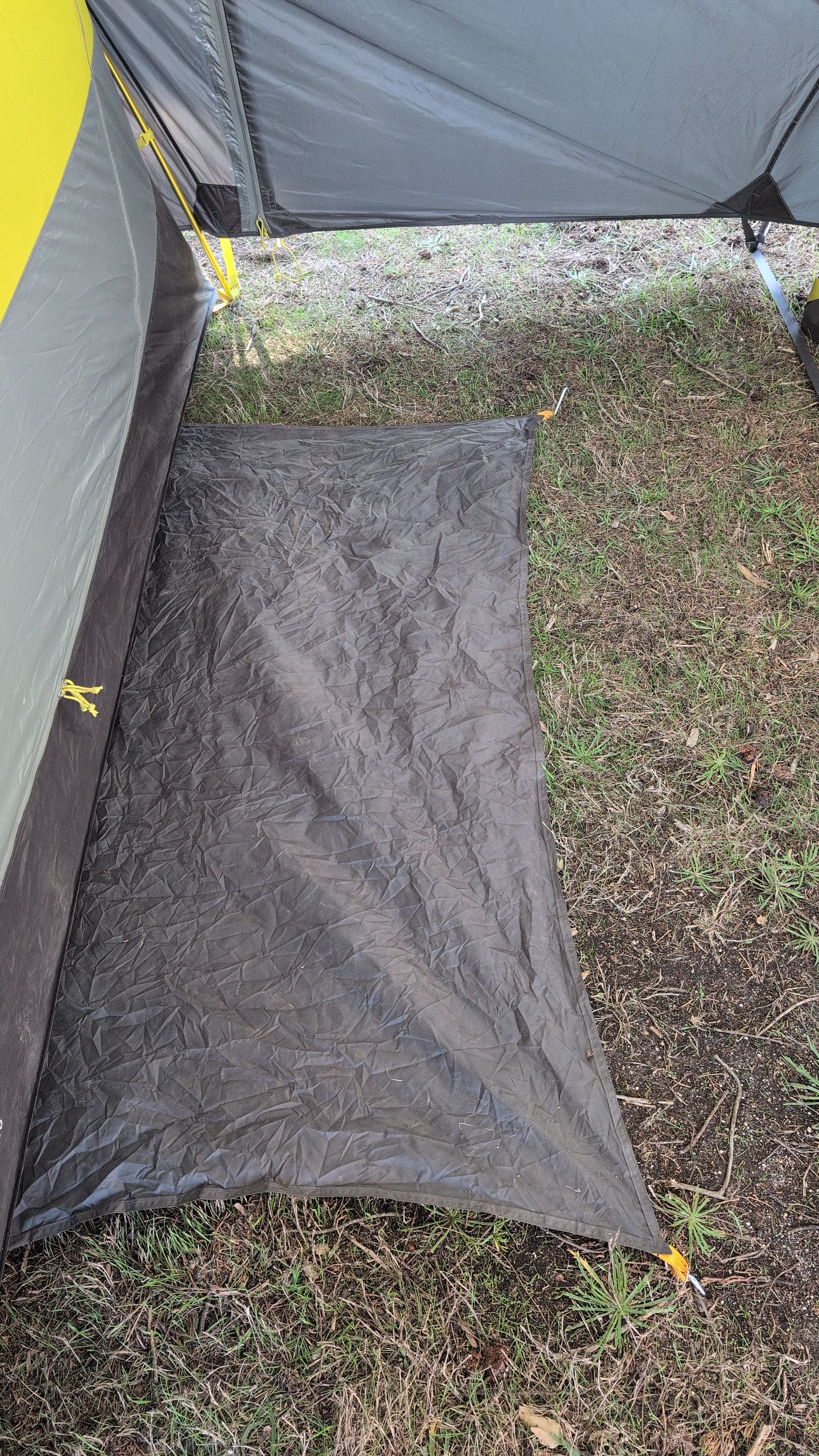 Photo showing doormat flap staked at front corners