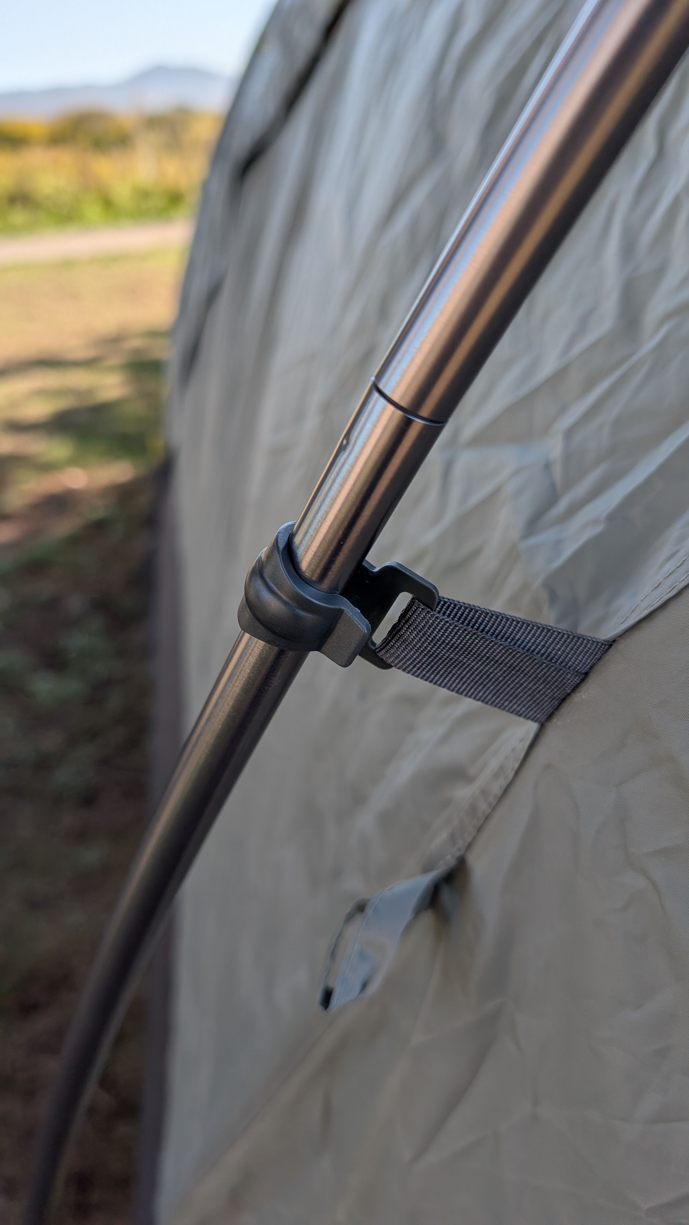 Photo showing gray clip connecting to vestibule pole