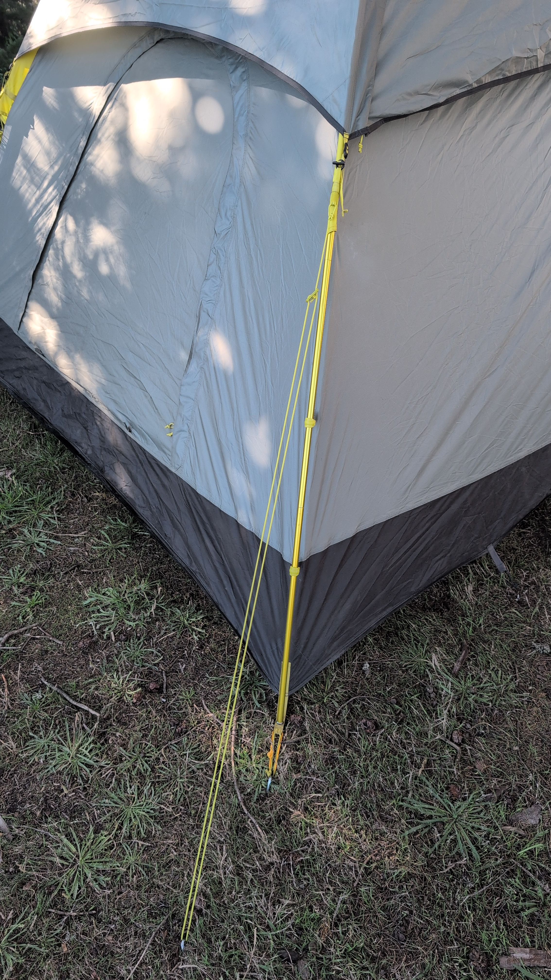 Photo showing guy line attached to fly loop and staked