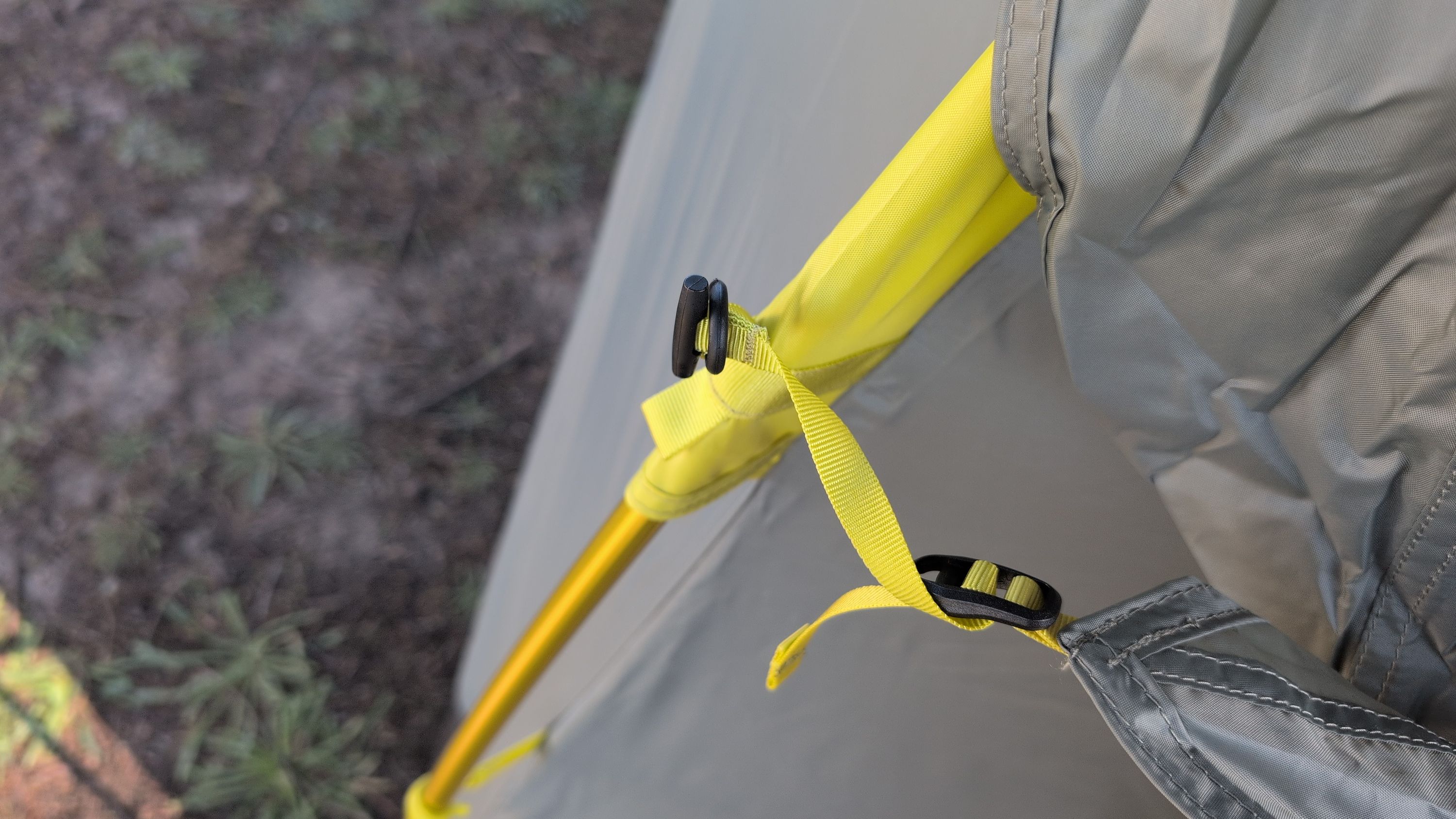 Close-up of rain fly clip connecting to back corner
