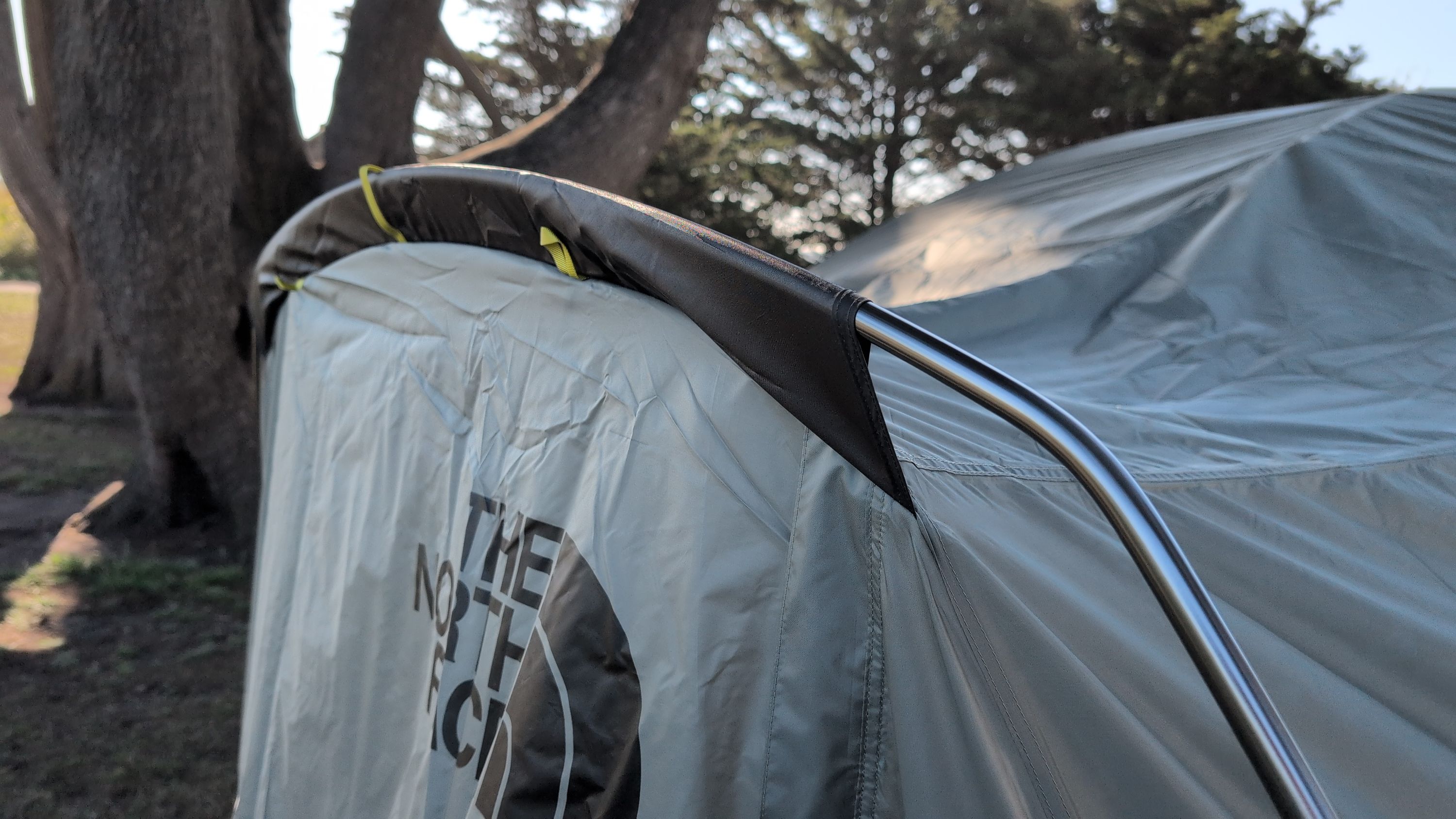 Photo showing gray vestibule pole being inserted into sleeve